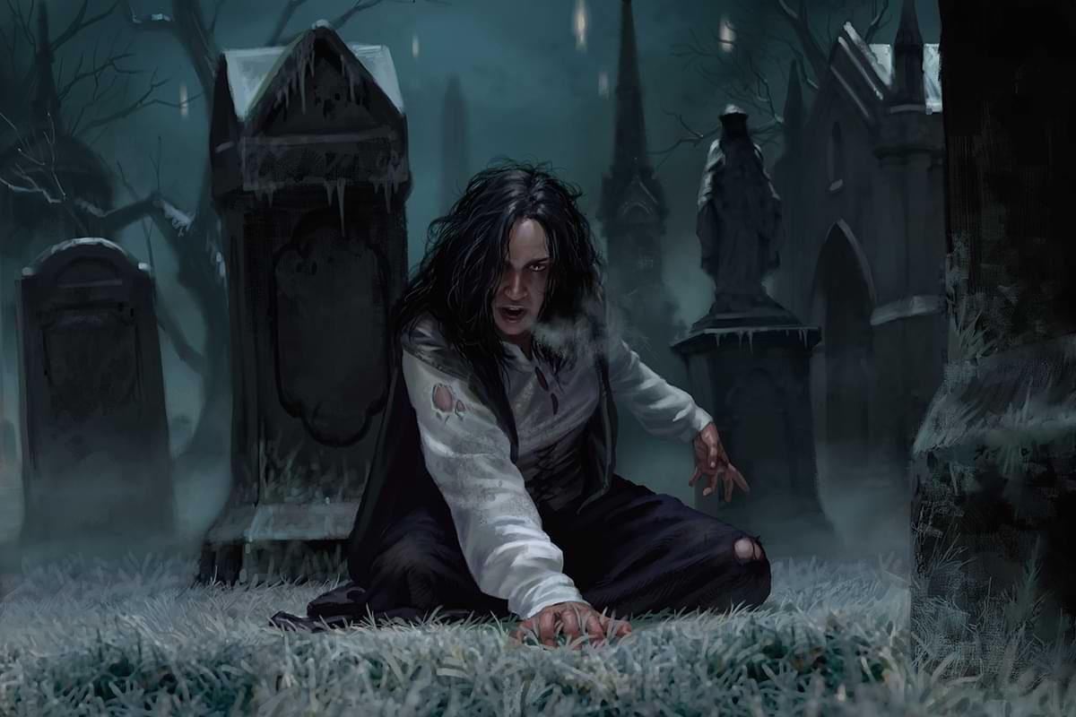 A long-haired person in tattered clothing kneels in a graveyard