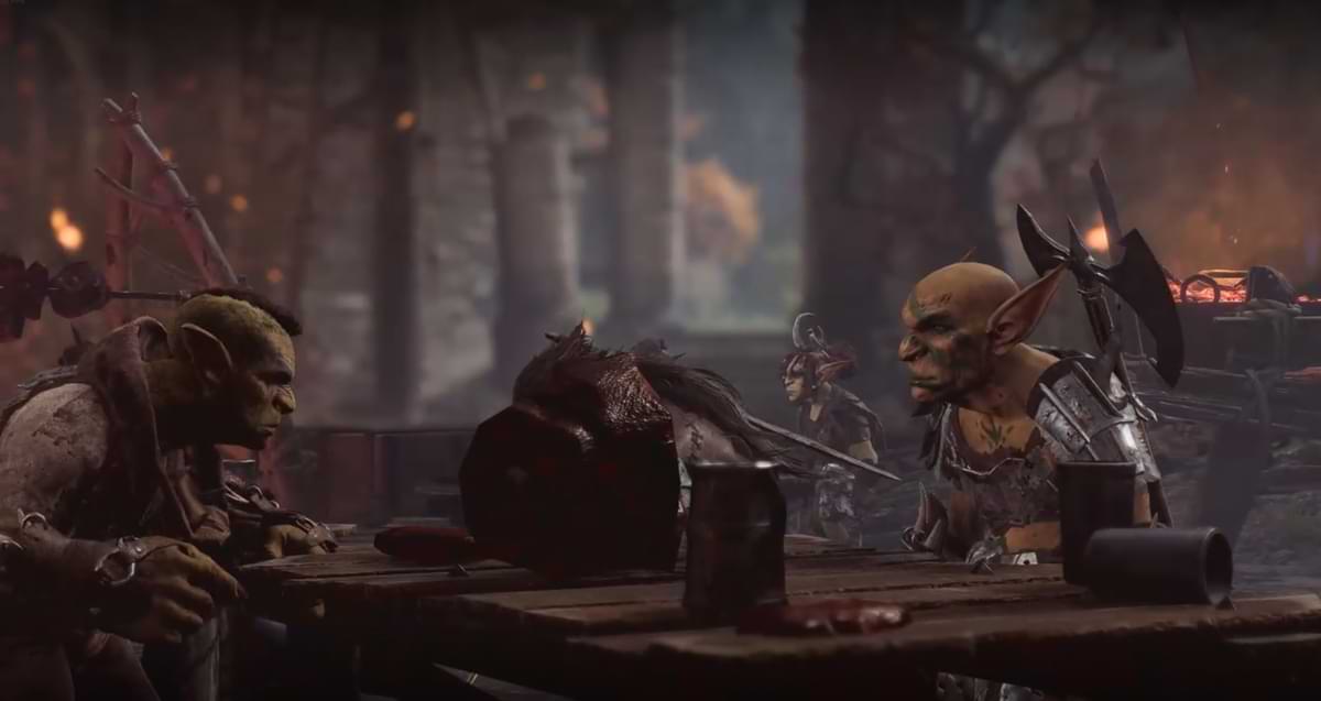 Goblins in armor and war paint sit at a table before cooked meat and drinks.